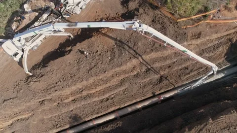 Aerial drone shot above constructions site outdoor. Heavy machinery white crane Stock Footage 131014934