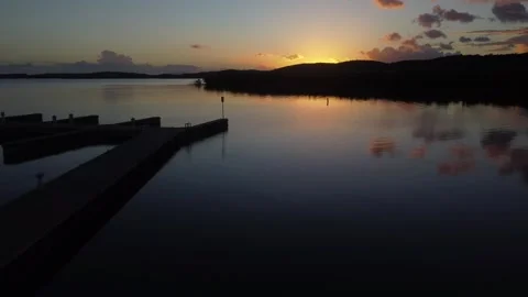 Aerial Drone Shot Advancing with View of Coastline With The Sunset Stock Footage 273835959
