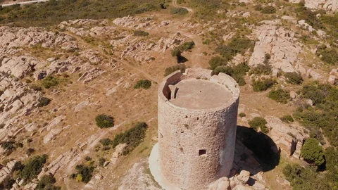 Aerial drone shot around a tower on the sea in south of Italy - Circular shot Stock Footage