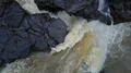 Aerial drone shot ascent rough waterfall straight down Bali Tenegungan 4k or 4k+ Resolution