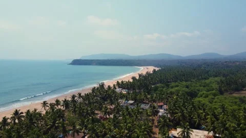 Aerial Drone shot of a beautiful empty and green beach in south goa Video stock 296674797
