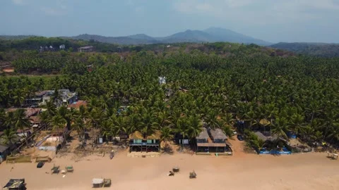 Aerial Drone shot of a beautiful empty and green beach in south goa Stock Footage 296674855