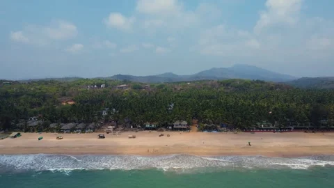 Aerial Drone shot of a beautiful empty and green beach in south goa Stock Footage 296674893