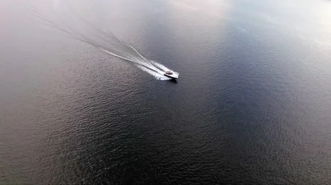 Aerial Drone Shot of Boat Passing Through Water Stock Footage