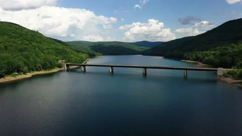 Aerial Drone Shot of a Bridge Over a Lake Stock Footage
