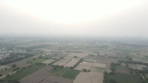 Aerial Drone shot of brown fields at day with blue sky background Stock Footage 160587650