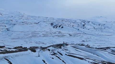Aerial drone shot capturing the breathtaking winter landscape of Langza in Stock Footage 304943665