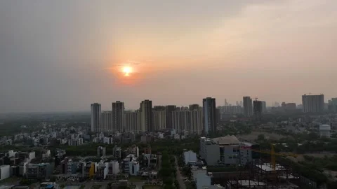 Aerial drone shot capturing cranes and scaffolding around a high-rise under Stock Footage 312488796