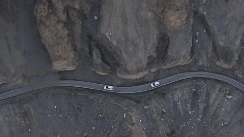 Aerial drone shot capturing the dramatic scenery of Spiti Valley, where a lone Stock Footage 304950395