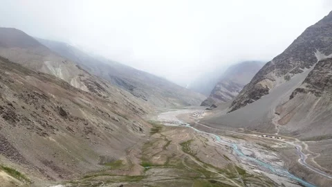 Aerial drone shot capturing the dramatic terrain of Ladakh with rugged mountains Stock Footage 310749853