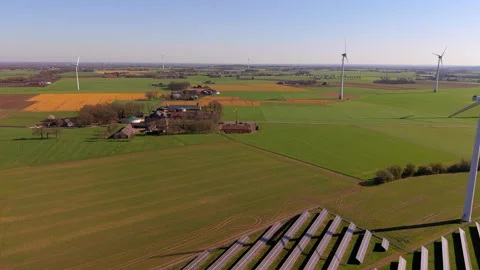 An aerial drone shot capturing a green energy park with a ground-mounted solar Video stock 336459952