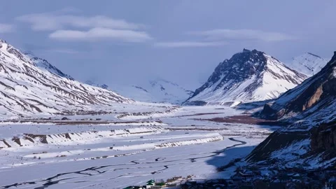 Aerial drone shot capturing the mesmerizing scene of Kaza in peak winter, as Stock-Footage 304945241
