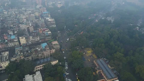 Aerial drone shot capturing the movement of people and vehicles in Chandni Stock Footage 305833608