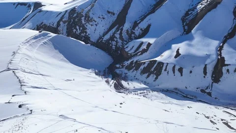 Aerial drone shot capturing the pristine beauty of freshly snow-covered Stock Footage 304952657
