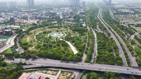 Aerial drone shot capturing roadways surrounded by residential complexes in Stock Footage 312488203