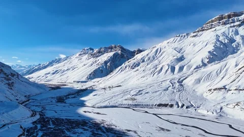 Aerial drone shot capturing the silence and isolation of Spiti in winter, where Stock Footage 304944139