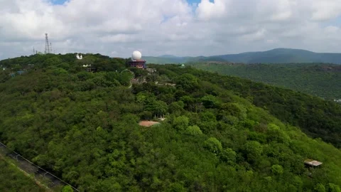 Aerial drone shot capturing the sprawling urban layout of Vizag city, with the Stock-Footage 297598720