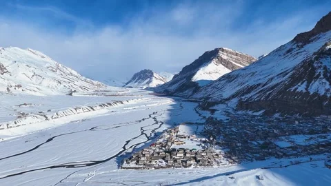 Aerial drone shot capturing the stunning view of Kaza city blanketed in snow, Stock Footage 304944170