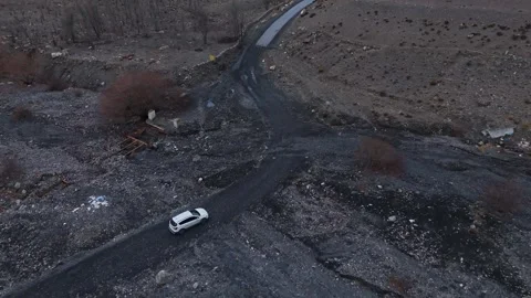 Aerial drone shot capturing the thrill of driving through Spiti’s rugged Stock-Footage 304951204