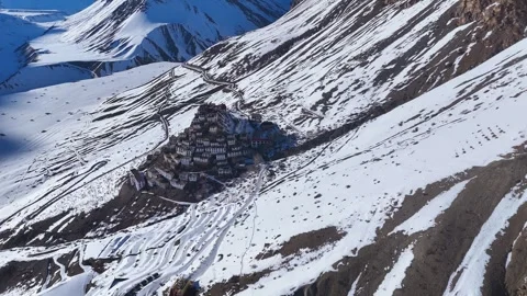 Aerial drone shot capturing the tranquility of Key Monastery under a stunning Stock Footage 304954638
