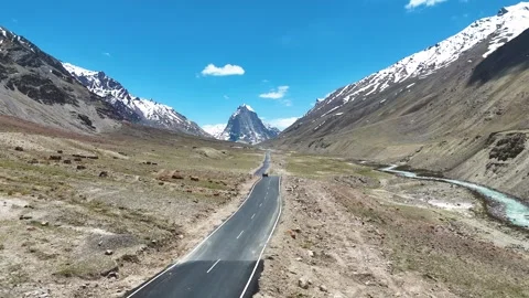 Aerial drone shot capturing the winding road leading up to Gombok Ranjan Stock Footage 310752467