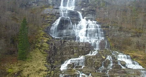 Aerial drone shot of cascade forest waterfall, Norway Stock Footage 137980995