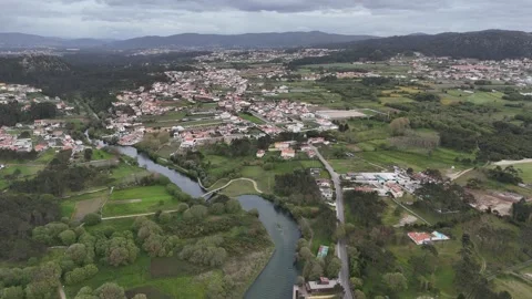 Aerial drone shot of Castelo do Neiva village and river in Portugal Stock Footage 338310961