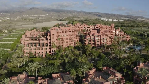 Aerial drone shot of cliff-side holiday resort in Tenerife Stock Footage 143387682