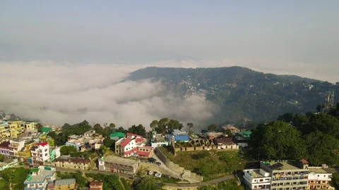 Aerial drone shot of cloud river forming in the mountains in the morning Stock Footage 296674296