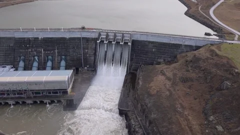 Aerial Drone Shot of Clyde Dam Spill Gates Open, Water Flowing Into Clutha Stock Footage 346451355