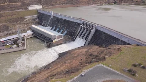 Aerial Drone Shot of Clyde Dam Spill Gates Open on Clutha River, New Zealand Stock Footage 346453612