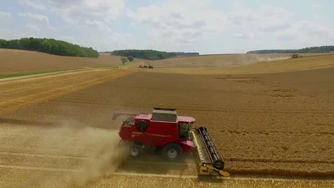 Aerial Drone Shot of a Combine Harvester working in a field Stock Footage