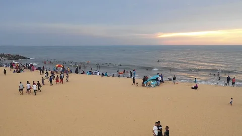 Aerial drone shot, crowded beach in Negombo, New Zealand 4K stabilized Stock Footage 107351175