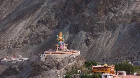 Aerial Drone shot of Diskit monastry buddha statue Stock Footage 293118372