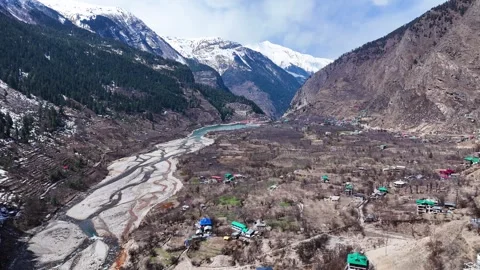 Aerial drone shot displaying the electrifying energy of Sangla Holi, as the Stock Footage 304948219