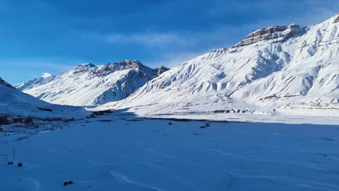 Aerial drone shot displaying the mesmerizing contrast of Spiti’s icy river Stock Footage 304944065