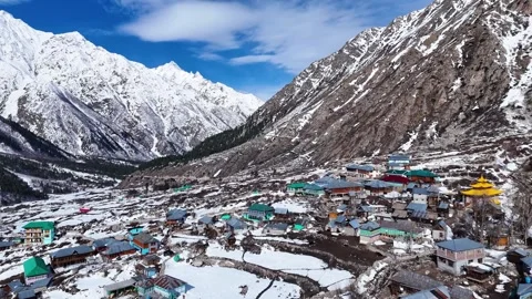 Aerial drone shot displaying the mesmerizing winter charm of Chitkul, where Stock Footage 304947371