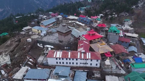 Aerial drone shot displaying a panoramic view of Kalpa, surrounded by lush green Stock Footage 304961853