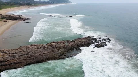 Aerial drone shot of a dramatic rock formation in the ocean off Vizag, Stock Footage 297599177