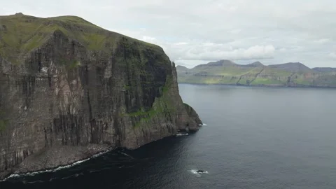 Aerial drone shot of dramatic Trøllkonufingur on the Faroe Islands Stock Footage 337859817