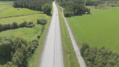 Aerial drone shot of E4 highway with cars in Swedish landscape – 4K LOG DJI 스톡 동영상 314024876