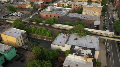 Aerial Drone Shot of Elevated Subway Train in Brooklyn New York Neighborhood Stock Footage 235502839