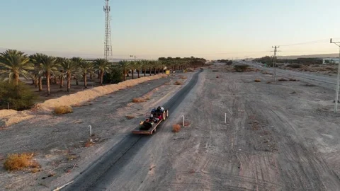 Aerial drone shot of expansive date palm plantations in the Arava Desert Stock Footage 296589312
