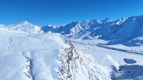 Aerial drone shot featuring an endless stretch of snow-clad mountains in Spiti, Stock Footage 304952154