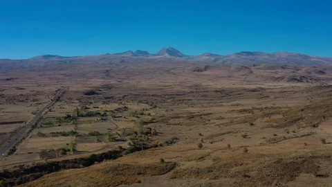 Aerial drone shot of fields and car road on background of Ararat 스톡 동영상 124097816