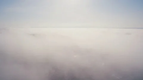 Aerial Drone Shot Of Fluffy Clouds Covering Landscape Against Sky Stock Footage 79654666