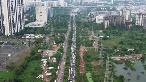 Aerial drone shot flying back revealing kilometres of traffic jam due to flooded Stock Footage 314914010