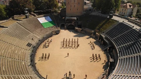 Aerial drone shot flying down and above musicians of the Conscript Band of Stock Footage 104561966
