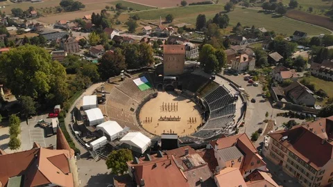 Aerial drone shot flying down and towards musicians of the Conscript Band Stock Footage 104645355