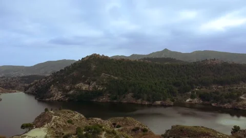 Aerial Drone Shot Flying down wide view of mountains and a lake Stock Footage 151483078